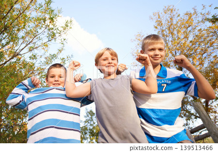 Happy children, portrait and flexing muscles at park for fun day, holiday or weekend together in nature. Face of young kids or friends smile for outdoor summer break, bonding or youth on playground Happy children, portrait and flexing muscles at park for fun day, holiday or weekend together in nature. Face of young kids or friends smile for outdoor summer break, bonding or youth on playground 139513466