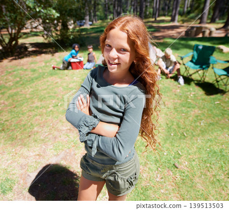 Girl, kid and arms crossed in portrait summer camp and nature with fun outdoor for youth. Child at campsite in forest, adventure and vacation, childhood and recreation with happiness and smile 139513503