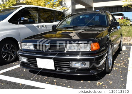 A black car parked in the parking lot A black car parked in the parking lot 139513530