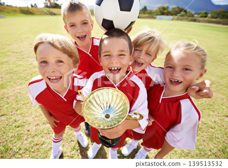 Celebration, soccer team and children with cup, boys and girls with victory, support or proud. Achievement, sports and friendship, together and happy for win, ready for game or physical activity Celebration, soccer team and children with cup, boys and girls with victory, support or proud. Achievement, sports and friendship, together and happy for win, ready for game or physical activity 139513532