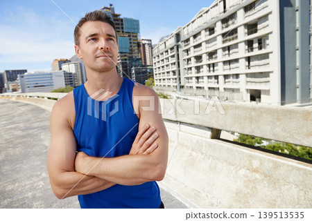 Man, arms crossed in city and fitness, thinking outdoor with workout and training, athlete with sports future and dream. Confidence, decision and exercise on urban bridge for health and wellness 139513535