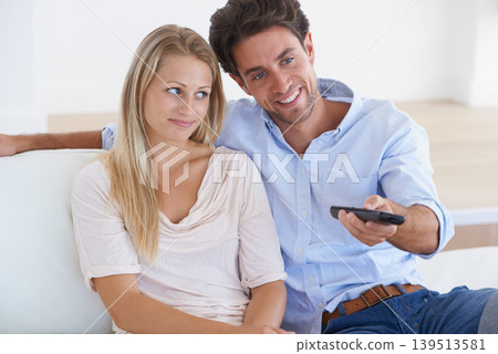 Relax, relax or happy couple watching tv or movie on online subscription or enjoying fun videos or news. Smile, love or woman streaming a film with a romantic man at home on sofa or couch in lounge 139513581