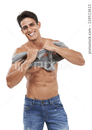Man, portrait and smiling or pride for fashion in studio, happy and style by white background. Male person, abs and strong core or muscular abdomen, confident and results or progress from fitness 139513615