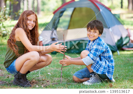 Start, campfire or portrait of children in forest for summer camp, teamwork or learning together. Smile, spark or friends on adventure with sticks or happy kids in woods on holiday vacation in nature 139513617