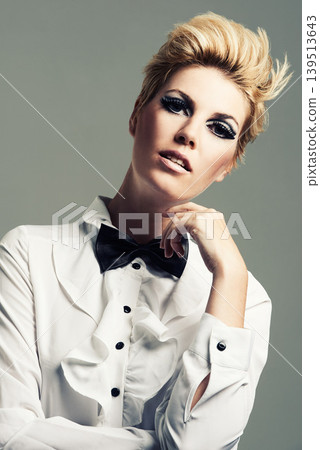 Makeup, bow tie or portrait of fashion model with vintage clothes or classy aesthetic in studio. Confidence, edgy woman or cool girl with retro style, elegance and beauty isolated on grey background Makeup, bow tie or portrait of fashion model with vintage clothes or classy aesthetic in studio. Confidence, edgy woman or cool girl with retro style, elegance and beauty isolated on grey background 139513643