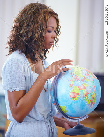 Happy black woman, teacher and earth globe for geography, history or planet in classroom or auditorium. African female person or educator smile holding 3D model of world or map for learning locations 139513673