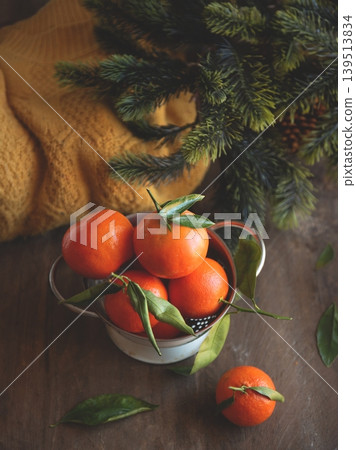 Warm and cozy still life with tangerines. 139513834