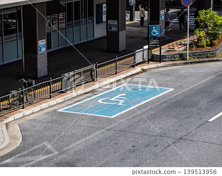 A designated boarding and alighting area for people with disabilities located in the rotary in front of the station. A designated boarding and alighting area for people with disabilities located in the rotary in front of the station. 139513956