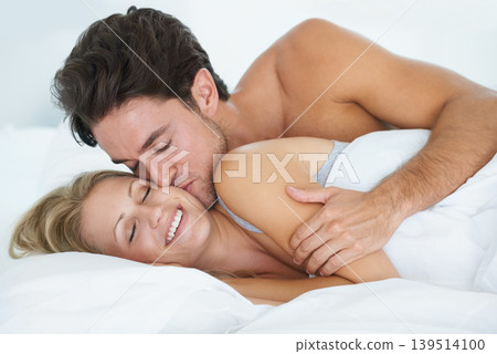 Man, kiss or happy woman sleeping in bed for peace or dreaming to relax on holiday vacation. Wake up, romantic love or couple on break together enjoying nap, bedroom sleep or resting at night in home 139514100