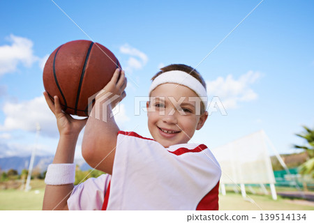 Happy girl, portrait and basketball on field for outdoor match or fun game in nature. Face of young female person, kid or sports player smile with ball on green grass and cloudy blue sky for exercise Happy girl, portrait and basketball on field for outdoor match or fun game in nature. Face of young female person, kid or sports player smile with ball on green grass and cloudy blue sky for exercise 139514134