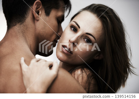 Couple, hug and touch with skin in studio, topless and sensual with moment isolated on white background. People hug, fashion or beauty with intimacy, wellness and embrace with love and romance Couple, hug and touch with skin in studio, topless and sensual with moment isolated on white background. People hug, fashion or beauty with intimacy, wellness and embrace with love and romance 139514156