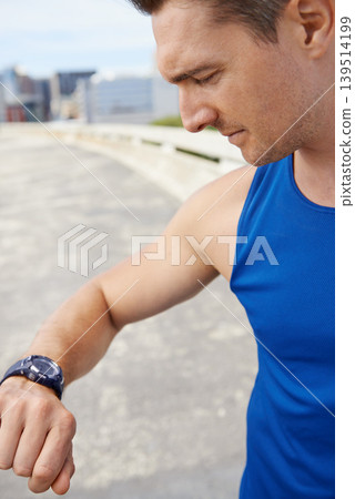 Man, fitness and looking at watch in city for workout, exercise or monitoring outdoor performance. Closeup of male person or athlete checking wristwatch for training or heart rate in an urban town 139514199