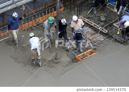 Image of the concrete pouring process for the slab. Image of the concrete pouring process for the slab. 139514370