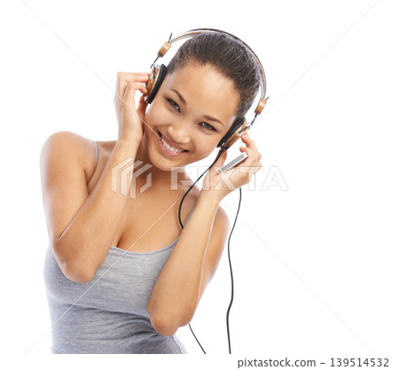 Happy woman, portrait and headphones listening to radio, audio or streaming against a white studio background. Female person smile enjoying sound track, music or podcast with headset on mockup space Happy woman, portrait and headphones listening to radio, audio or streaming against a white studio background. Female person smile enjoying sound track, music or podcast with headset on mockup space 139514532