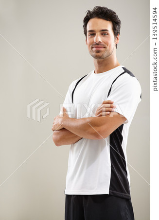 Arms crossed, portrait or athlete in studio for fitness workout, sports exercise or healthy wellness. Mockup space, grey background or man ready to start training with confidence, discipline or pride Arms crossed, portrait or athlete in studio for fitness workout, sports exercise or healthy wellness. Mockup space, grey background or man ready to start training with confidence, discipline or pride 139514594