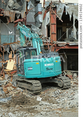 A scene from a demolition site: Heavy machinery and rubble tell the story of urban regeneration. A scene from a demolition site: Heavy machinery and rubble tell the story of urban regeneration. 139514602