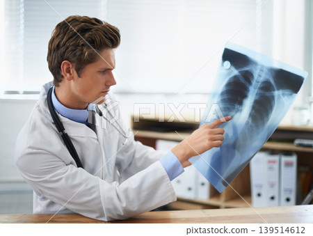 Man doctor in office, analysis of xray and health, medical diagnosis and review of lung scan at cardiology clinic. Radiology, assessment of results and human anatomy with surgeon, MRI and skeleton Man doctor in office, analysis of xray and health, medical diagnosis and review of lung scan at cardiology clinic. Radiology, assessment of results and human anatomy with surgeon, MRI and skeleton 139514612