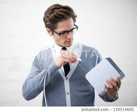 Man, job and hard drives for storage space, geek and cables for computer, working and young. Technician, excited and laughing with corporate clothes, fashionable and glasses for technology computing Man, job and hard drives for storage space, geek and cables for computer, working and young. Technician, excited and laughing with corporate clothes, fashionable and glasses for technology computing 139514685