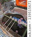 A beautiful water basin with flowers and a dragon at a shrine in Kyoto. 139515671