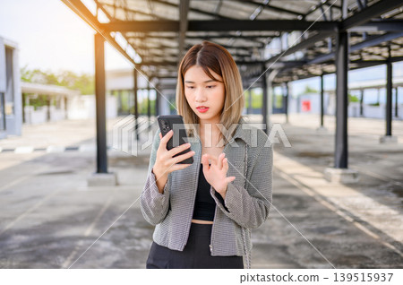 asian businesswoman use smartphone for working or shopping online outdoor asian businesswoman use smartphone for working or shopping online outdoor 139515937