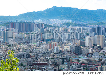 Seoul, South Korea - Mar. 08, 2026 : Panoramic cityscape of Seoul with dense residential buildings and Han River from Yongmasan observatory Seoul, South Korea - Mar. 08, 2026 : Panoramic cityscape of Seoul with dense residential buildings and Han River from Yongmasan observatory 139515958