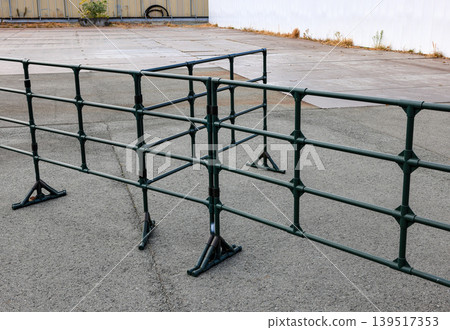 Steel railing along the park walkway. Steel railing along the park walkway. 139517353