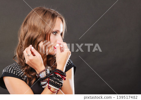 woman with jewellery in black evening dress woman with jewellery in black evening dress 139517482