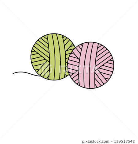 Two yarn balls, green and pink, sit side by side Two yarn balls, green and pink, sit side by side 139517548