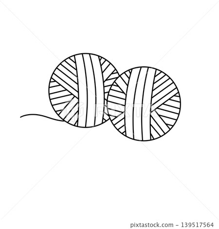 Two yarn balls rest side by side 139517564