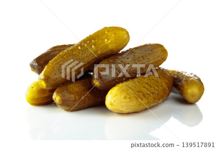 Homemade pickled cucumbers isolated on a white background. Homemade pickled cucumbers isolated on a white background. 139517891