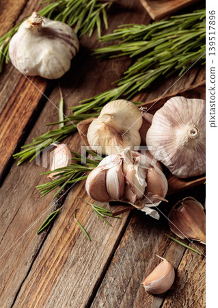 Fresh garlic bulbs and rosemary. Fresh garlic bulbs and rosemary. 139517896