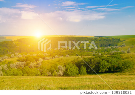 Scenic Summer Sunrise over Green Hills and Lush Valley Landscape Scenic Summer Sunrise over Green Hills and Lush Valley Landscape 139518021