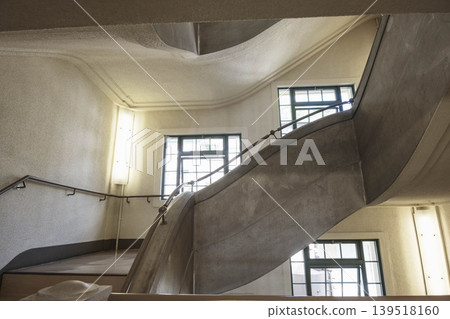A staircase in a retro building, photographed at the Kobe City Overseas Emigration and Cultural Exchange Center. A staircase in a retro building, photographed at the Kobe City Overseas Emigration and Cultural Exchange Center. 139518160