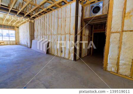 Construction site walls with insulation empty space in building during renovation Construction site walls with insulation empty space in building during renovation 139519011