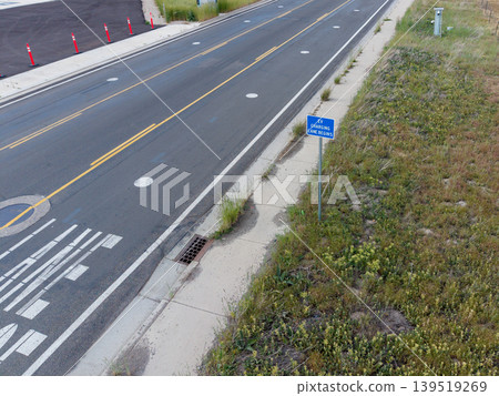 Electric vehicle charging lane begins sign on road in Salt Lake City 139519269