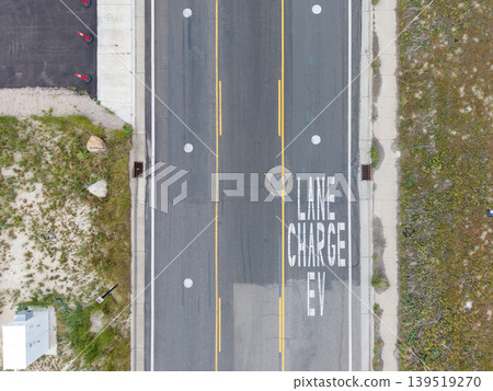 Electric vehicle charging lane markings on an asphalt road in Salt Lake City. Electric vehicle charging lane markings on an asphalt road in Salt Lake City. 139519270