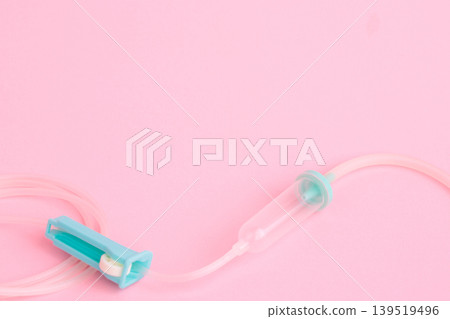 IV tube and pink background - Medical image material 139519496