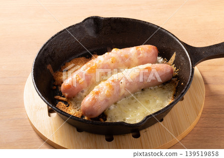 Baked sausages with cheese 139519858