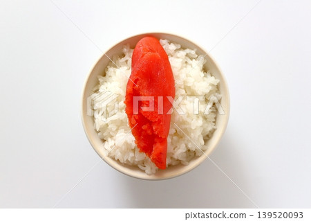 White rice and cod roe in a bowl, viewed from directly above against a white background. White rice and cod roe in a bowl, viewed from directly above against a white background. 139520093