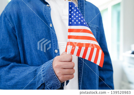 Learn English language, Asian teenage student hold book with flag in course at school. 139520983