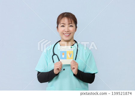 A female medical staff member guides you through the process of using your medication record book. A female medical staff member guides you through the process of using your medication record book. 139521874