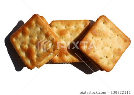 Golden crispy crackers isolated on white background Golden crispy crackers isolated on white background 139522111