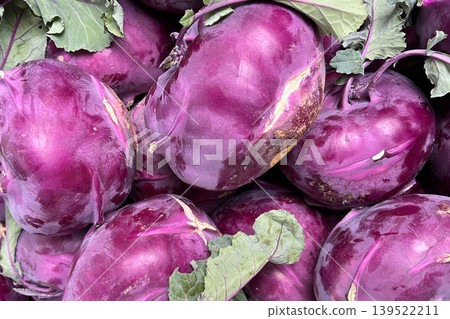 Fresh purple kohlrabi vegetables at market Fresh purple kohlrabi vegetables at market 139522211