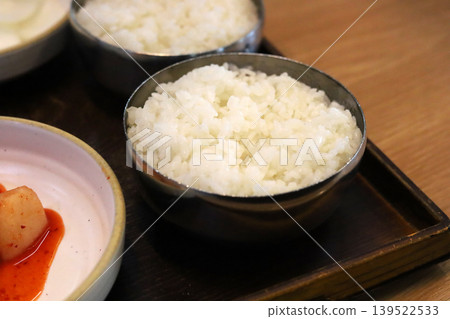 Steamed white rice served in traditional Korean metal bowl Steamed white rice served in traditional Korean metal bowl 139522533