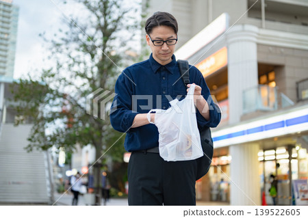 A man shopping at a convenience store A man shopping at a convenience store 139522605