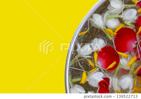 Water with flower in silver bowl. Thai tradition, Songkran festival concept Water with flower in silver bowl. Thai tradition, Songkran festival concept 139522713