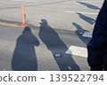 People shadows on asphalt road during sunny day 139522794
