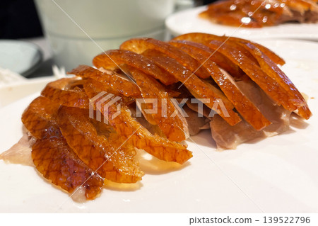 Chinese roasted duck sliced and served on white plate Chinese roasted duck sliced and served on white plate 139522796