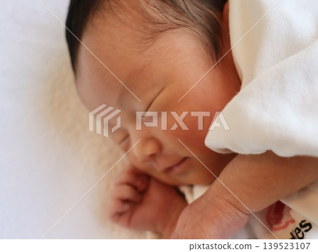 Newborn girl's smiling sleeping face, close-up, Japan | Parenting blog, social media ad, empathy appeal material Newborn girl's smiling sleeping face, close-up, Japan | Parenting blog, social media ad, empathy appeal material 139523107