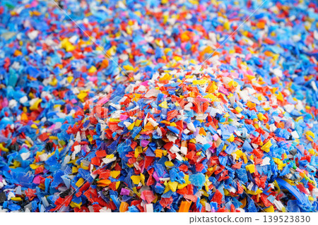 Plastic colorful pieces recycling shredded for industrial use. Plastic colorful pieces recycling shredded for industrial use. 139523830